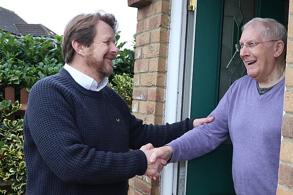 picture of councillor Peter Wilkins talking to resident