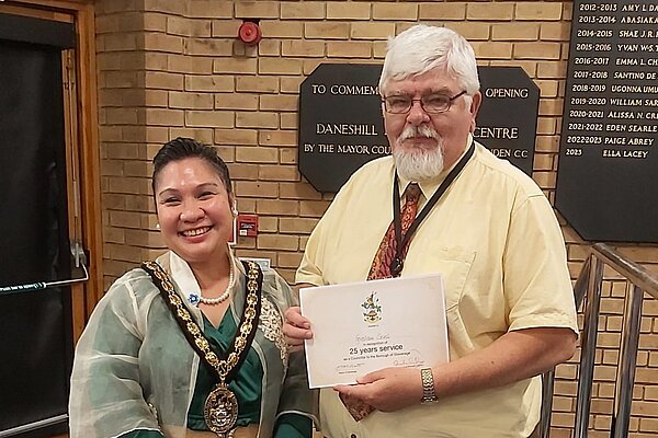 Councillor Graham Snell and then mayor Myla Arceno